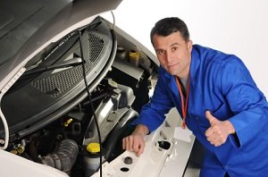 Man Inspecting a car engine