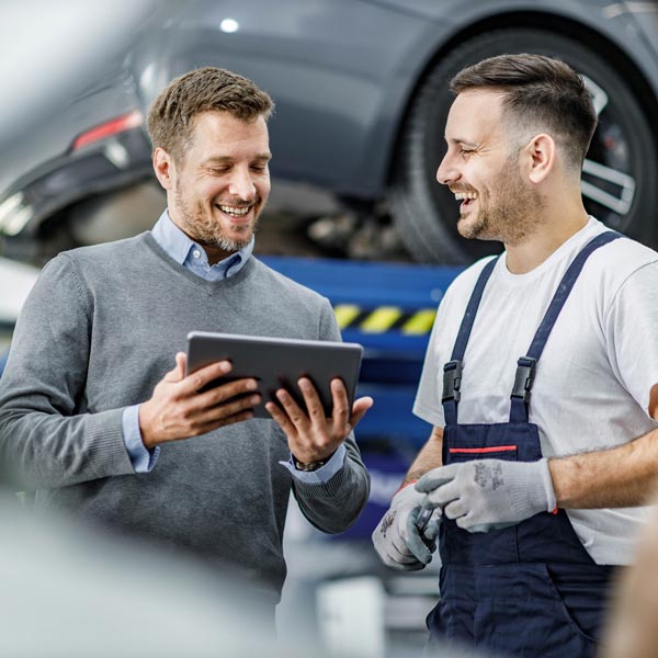 mechanic talking to customer